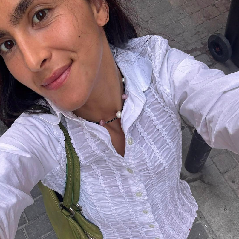 Maria, founder of Lila Archive styles the Pink Orbit Necklace